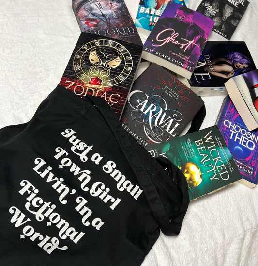 Romance book tote that reads just a small town girl living in a fictional world